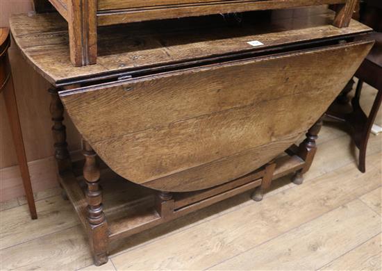 An 18th century oak oval topped gateleg table, W.120cm